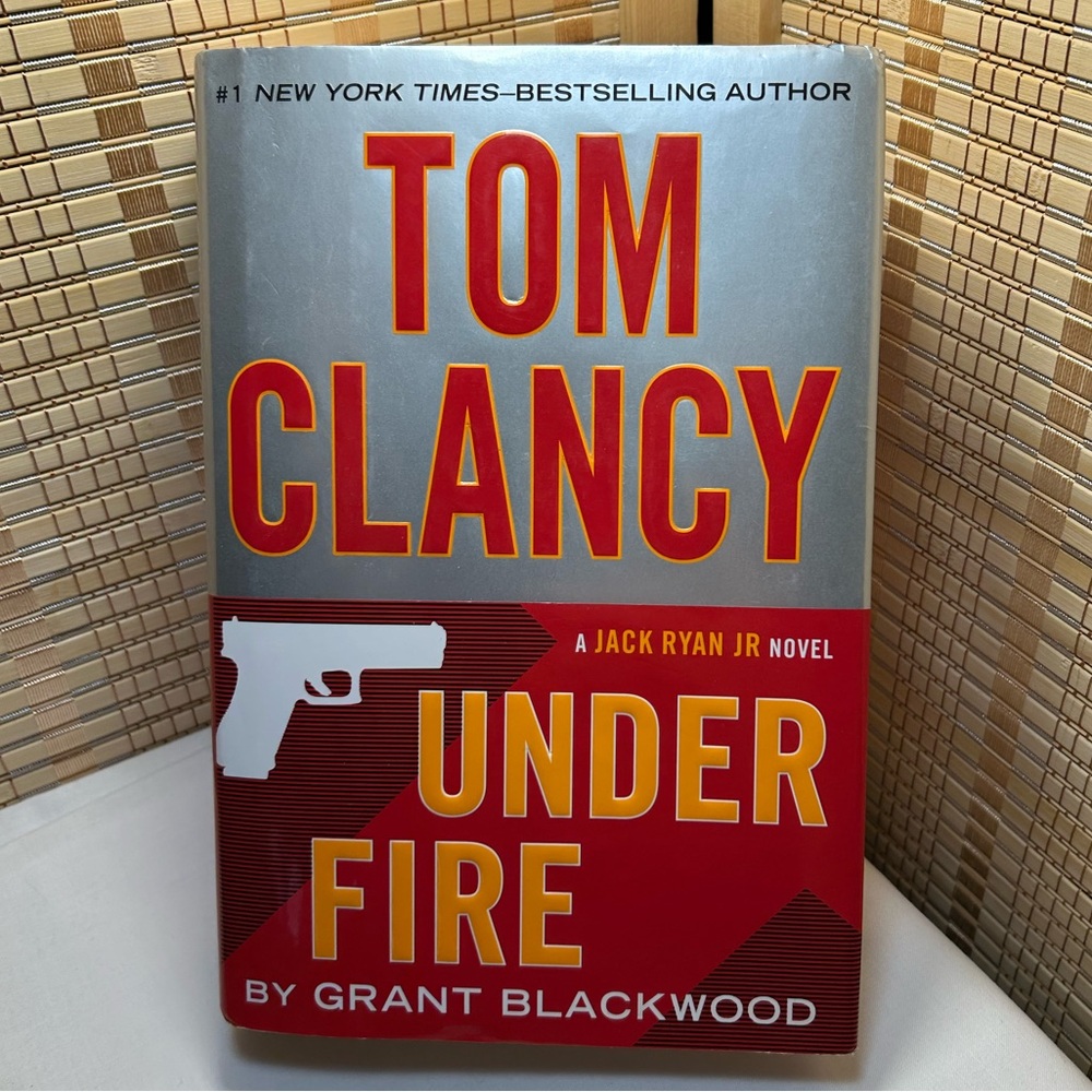 “Under Fire” Hardback Book